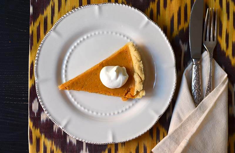 Uzbek Ikat table runner with a classic all America pumpkin pie