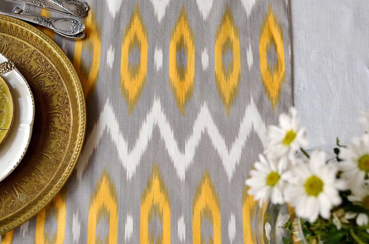 Yellow gray white geometric ikat table runner